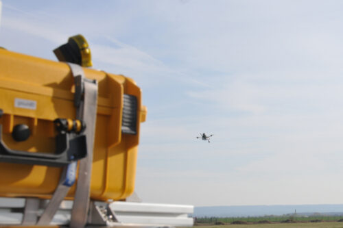 Drone in the sky and NoctuaNet2 system in the front